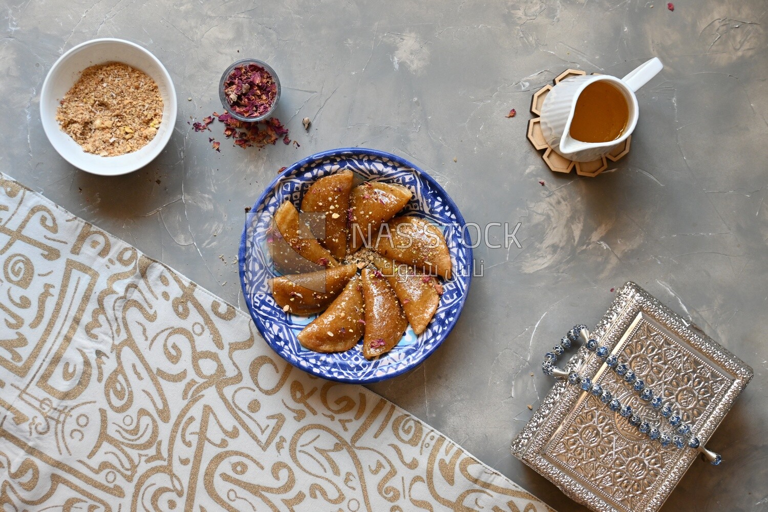 Plate of Qatayef with nuts, oriental Arabic sweets, Ramadan sweets