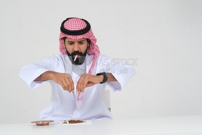 Saudi man fights against the smoking habit, tobacco addiction, cigarette addiction, harmful and toxic substance abuse, harmful behavioral habits, no smoking, Saudi model