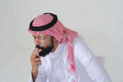 Saudi man wearing a white thobe and shemagh takes a deep breath from a cigarette, tobacco addiction, cigarette addiction, harmful and toxic substance abuse, harmful behavioral habits, no smoking, Saud