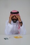 Saudi man sitting in front of many types of toxic substances, tobacco addiction, cigarette addiction, harmful and toxic substance abuse, harmful behavioral habits, no smoking, Saudi model