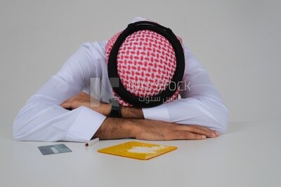 Saudi man sitting in front of many types of toxic substances, tobacco addiction, cigarette addiction, harmful and toxic substance abuse, harmful behavioral habits, no smoking, Saudi model