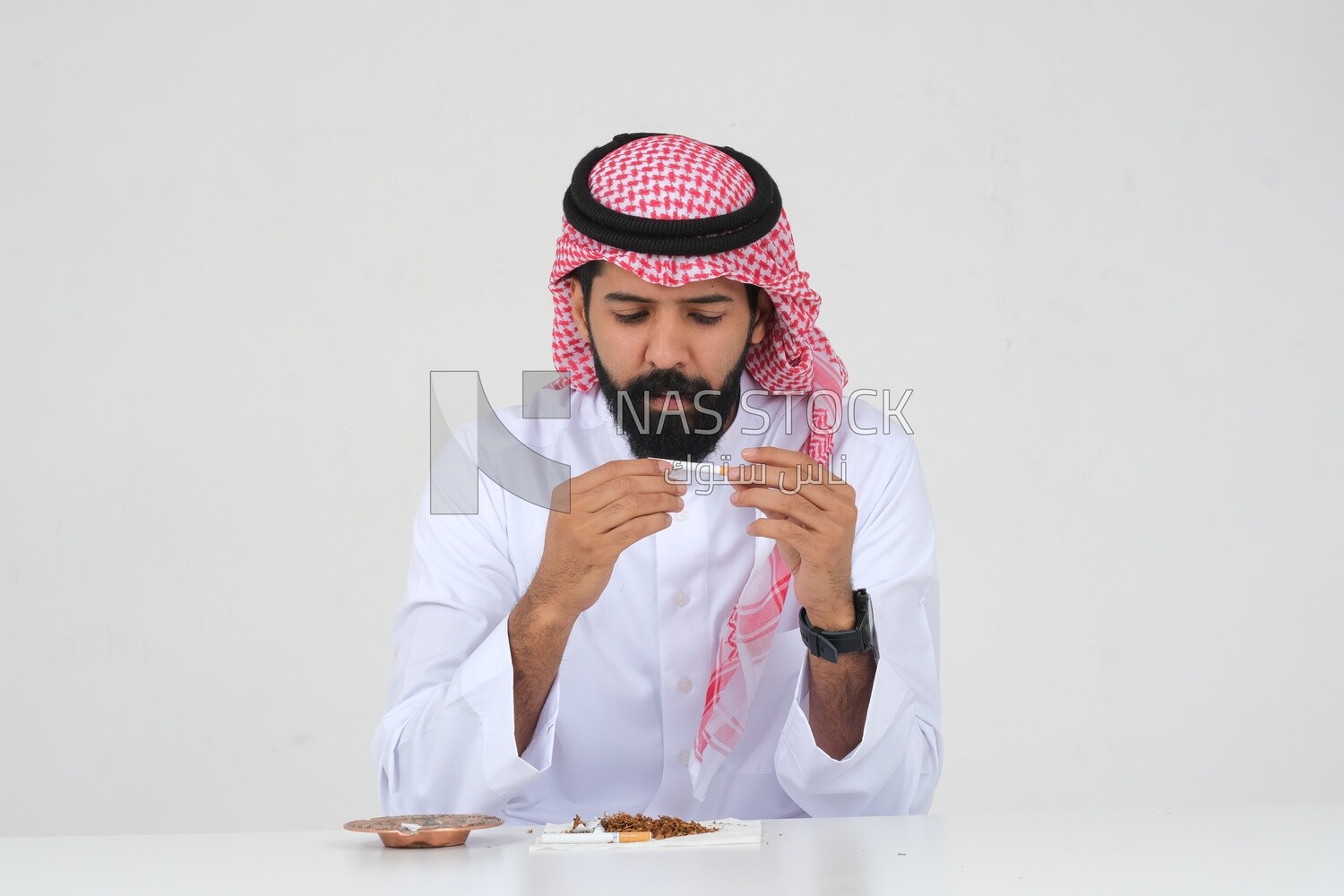 Saudi man fights against the smoking habit, tobacco addiction, cigarette addiction, harmful and toxic substance abuse, harmful behavioral habits, no smoking, Saudi model