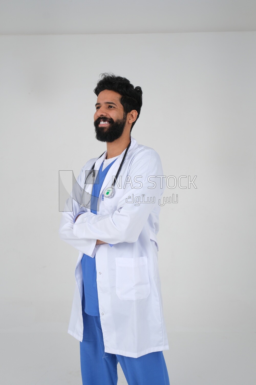 Saudi man wearing a medical coat and a stethoscope, white background, medicine and health care, Saudi model
