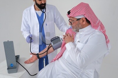 Saudi man wearing a medical coat and a stethoscope, measuring patient pressure, white background, medicine and health care, Saudi model