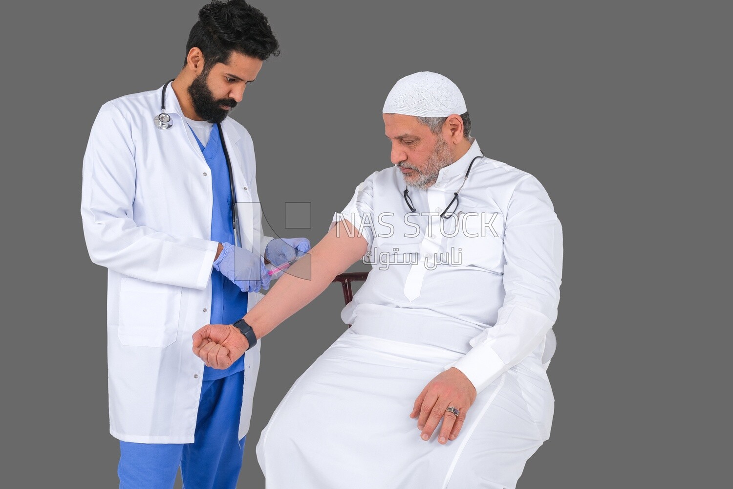 Saudi man wear medical coats and gloves and give Saudi patient injections, the concept of medicine and health care, and receive vaccinations in health centers, Saudi model