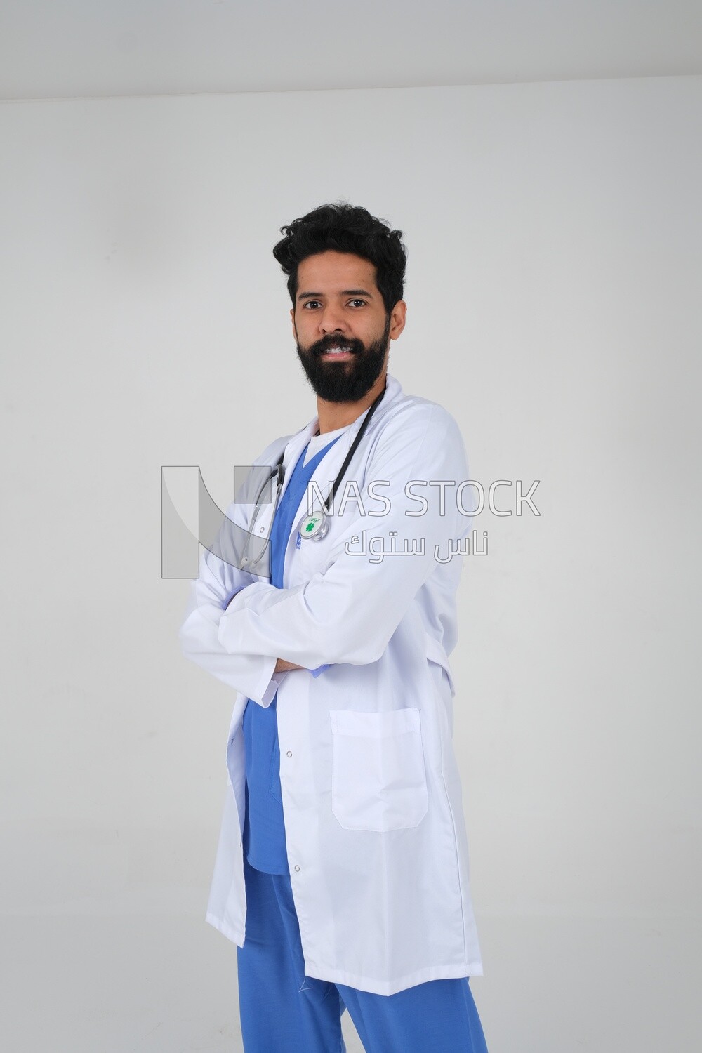 Saudi man wearing a medical coat and a stethoscope, white background, medicine and health care, Saudi model