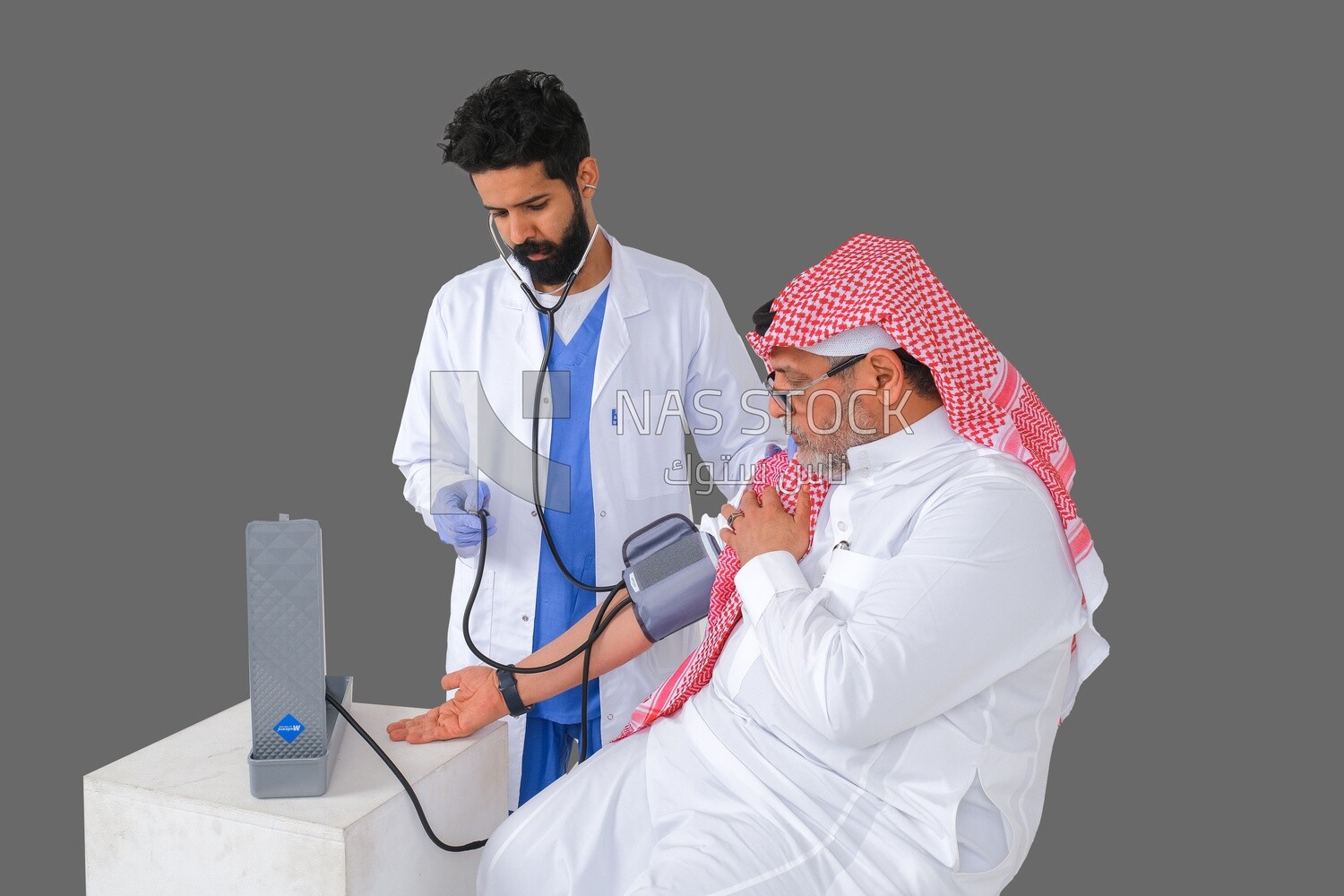 Saudi man wearing a medical coat and a stethoscope, measuring patient pressure, white background, medicine and health care, Saudi model