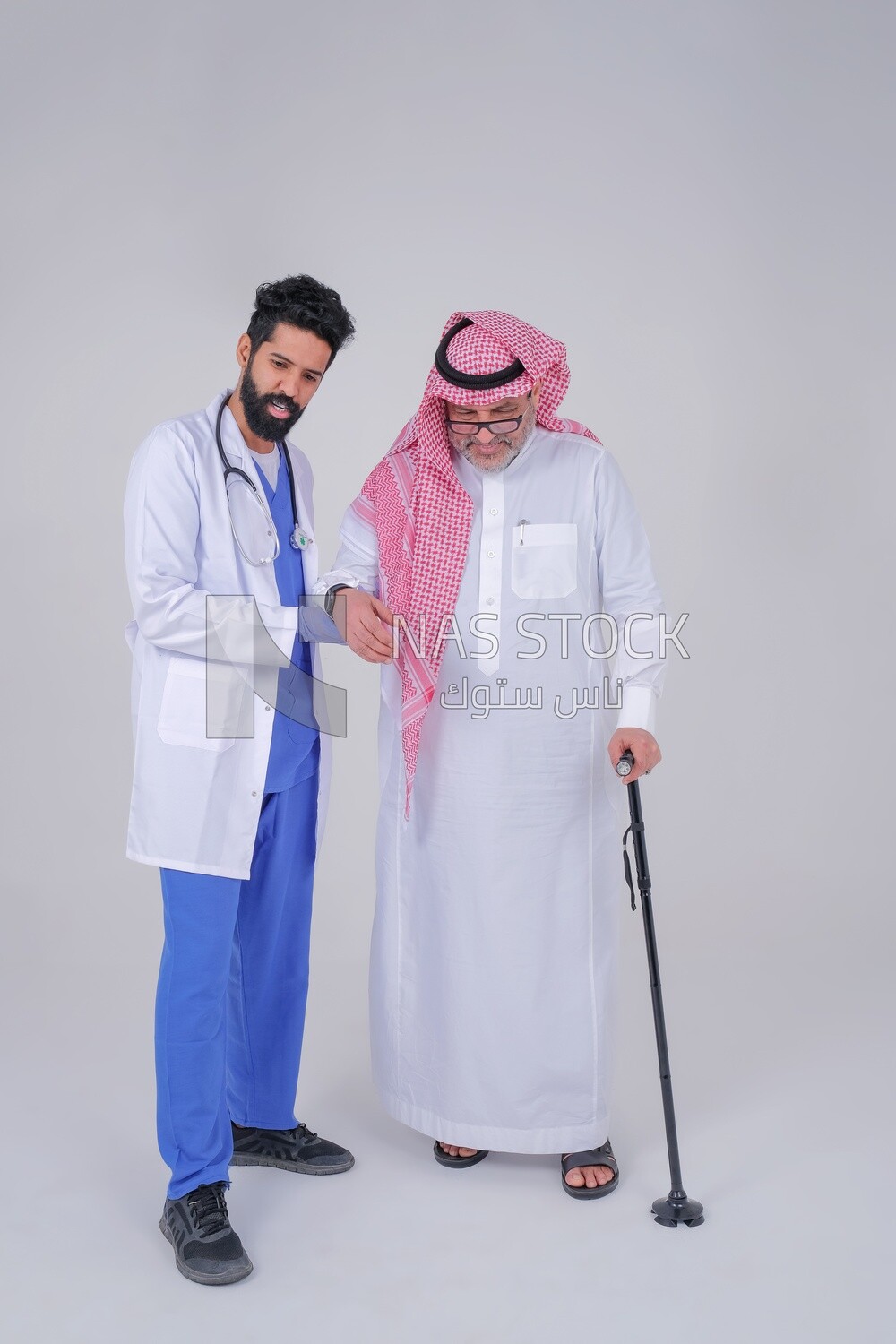 Saudi man wearing a medical coat and a stethoscope, helping the patient, white background, medicine and health care, Saudi model