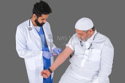 Saudi man wear medical coats and gloves and give Saudi patient injections, the concept of medicine and health care, and receive vaccinations in health centers, Saudi model