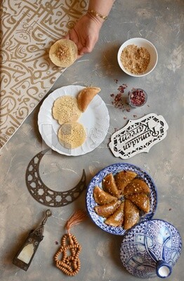 Hand stuffing Qatayef, nuts, oriental Arabic sweets, Ramadan sweets