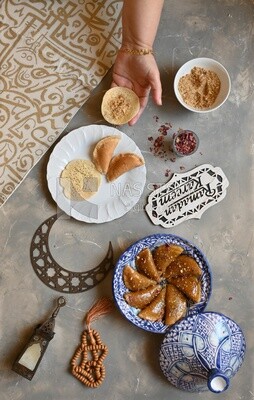 Hand stuffing Qatayef, nuts, oriental Arabic sweets, Ramadan sweets