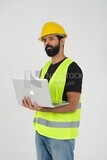 Saudi engineer wearing a work helmet and protective jacket, holding a laptop and looking away, engineering professions and jobs, white background, Saudi model