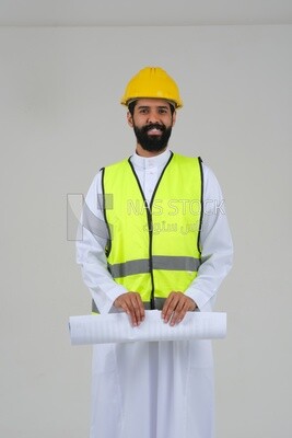 Saudi engineer wearing a work hat and safety vest, holding in his hand the construction plan, engineering professions and jobs, white background, Saudi model