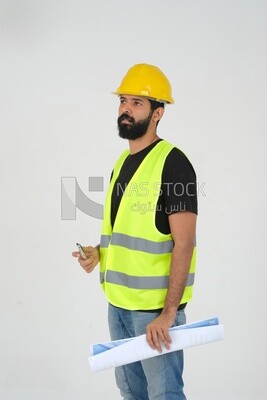 saudi engineer wearing a work hat and safety vest, holding in his hand the construction plan, engineering professions and jobs, white background, Saudi model