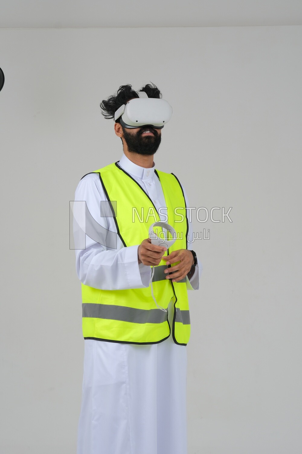 Saudi engineer wearing a safety vest, use the VR of 3D hologram technology, engineering professions and jobs, white background, Saudi model