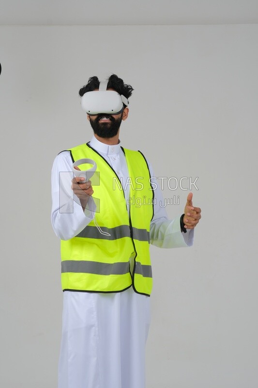 Saudi engineer wearing a safety vest, use the VR of 3D hologram