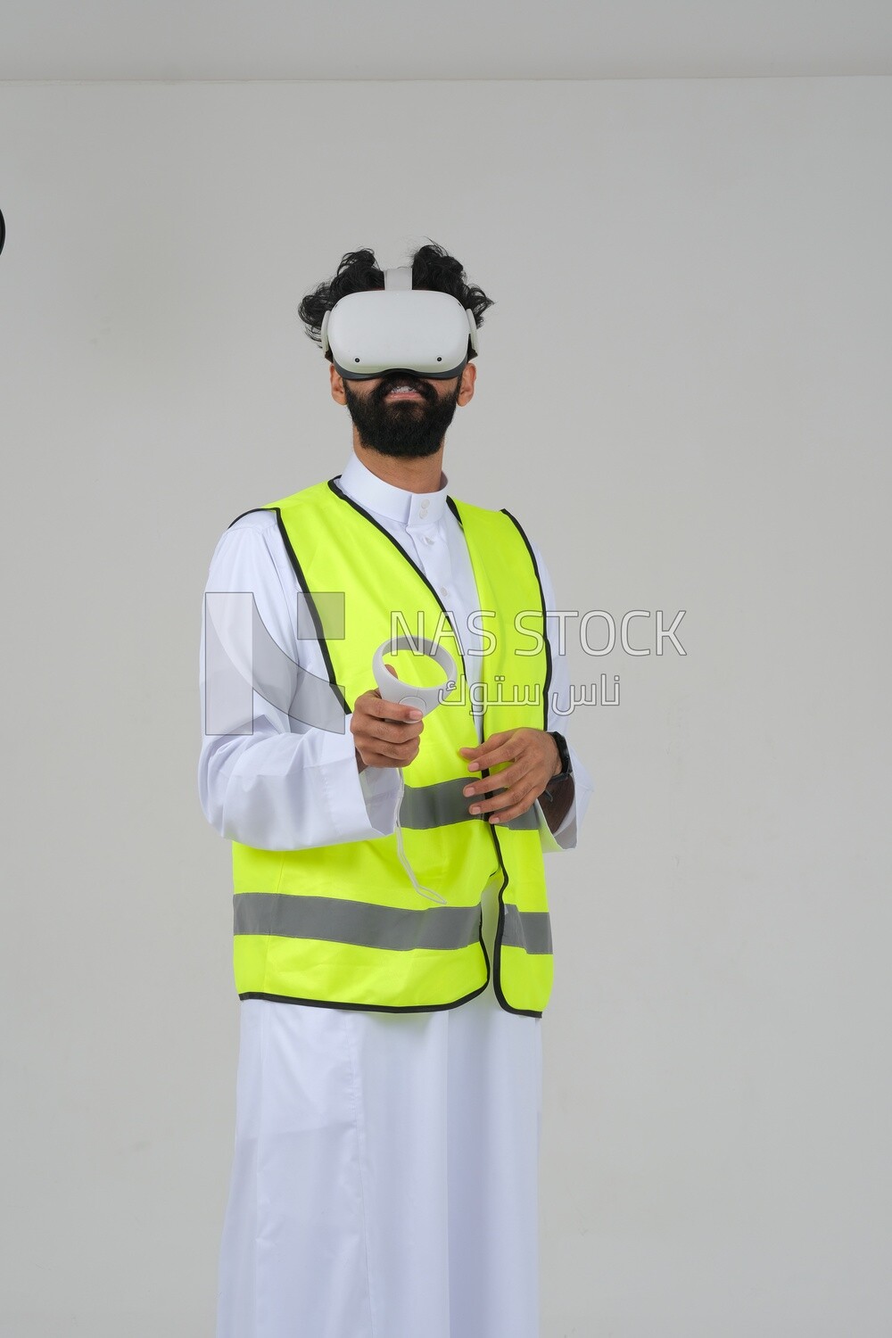 Saudi engineer wearing a safety vest, use the VR of 3D hologram technology, engineering professions and jobs, white background, Saudi model