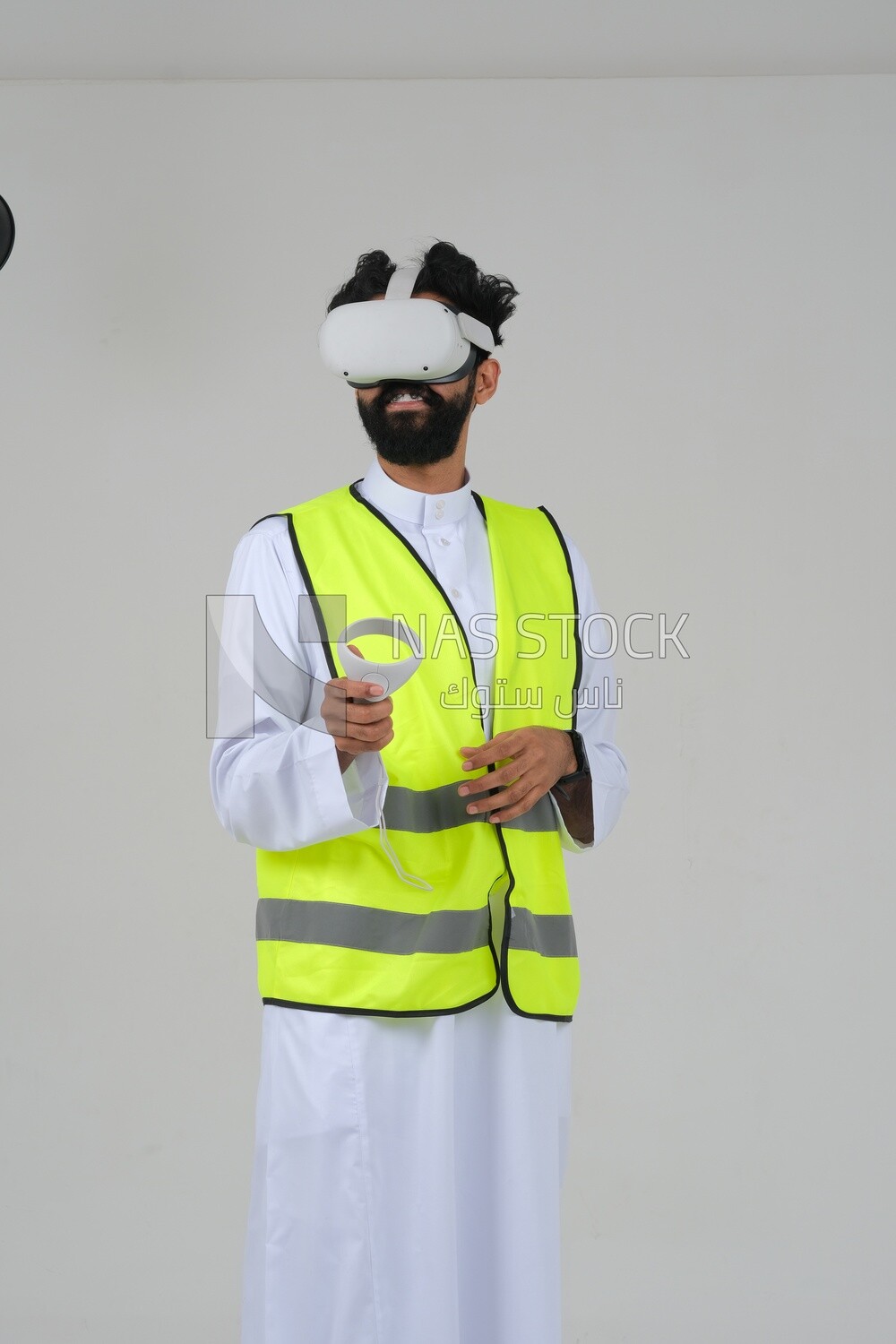 Saudi engineer wearing a safety vest, use the VR of 3D hologram technology, engineering professions and jobs, white background, Saudi model