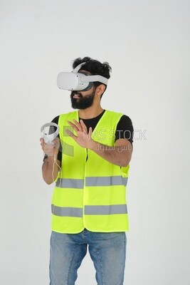 Saudi engineer wearing a safety vest, use the VR of 3D hologram technology, engineering professions and jobs, white background, Saudi model