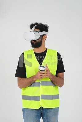 Saudi engineer wearing a safety vest, use the VR of 3D hologram technology, engineering professions and jobs, white background, Saudi model