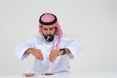 Saudi man fights against the smoking habit, tobacco addiction, cigarette addiction, harmful and toxic substance abuse, harmful behavioral habits, no smoking, Saudi model