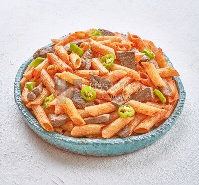 Side view of a pasta with liver