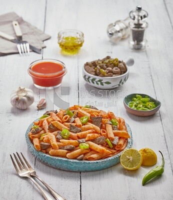 Dining table with liver pasta and appetizers