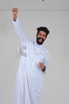 Saudi man wearing a white dress looks happy, facial gestures indicating happiness and joy, self-confidence, white background, Saudi model