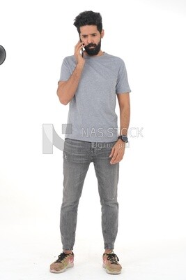 saudi man using a mobile phone, communicating with individuals, online requests and marketing, social relations, using technical devices, white background