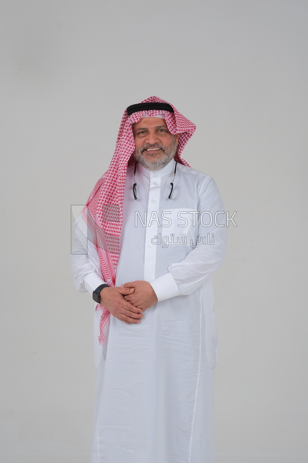 close-up of a Saudi man in traditional Saudi dress, Saudi model, white background