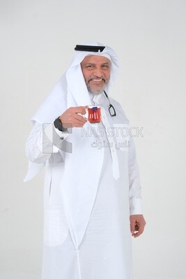 old Saudi man wearing a white dress, carrying a cup of tea, self-confidence, white background, Saudi model