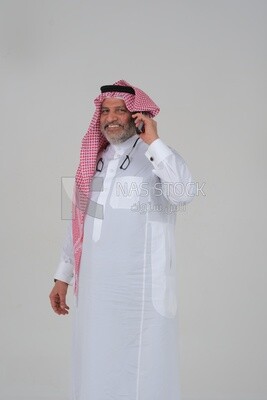 saudi man using a mobile phone, communicating with individuals, online requests and marketing, social relations, using technical devices, white background