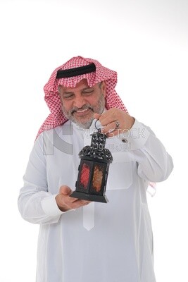 Saudi man holding a Ramadan lantern, Ramadan lantern, the blessed month of Ramadan, lighting and decorations for the month of Ramadan, Ramadan atmosphere, religious occasions