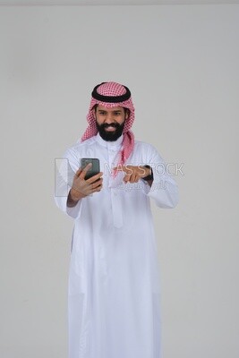 saudi man using a mobile phone, communicating with individuals, online requests and marketing, social relations, using technical devices, white background