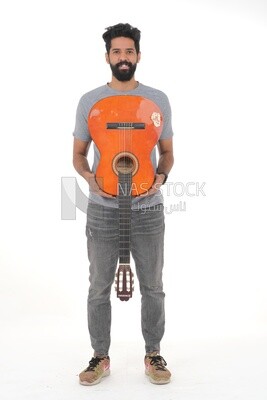 Saudi  man carrying a musical instrument, guitar playing talent, entertainment and singing, white background, Saudi model