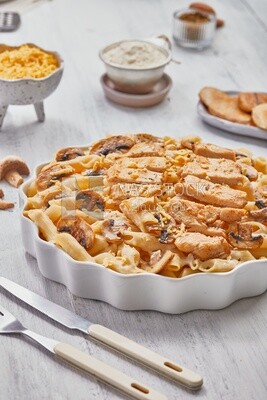 Side view of a plate of pasta with mushrooms