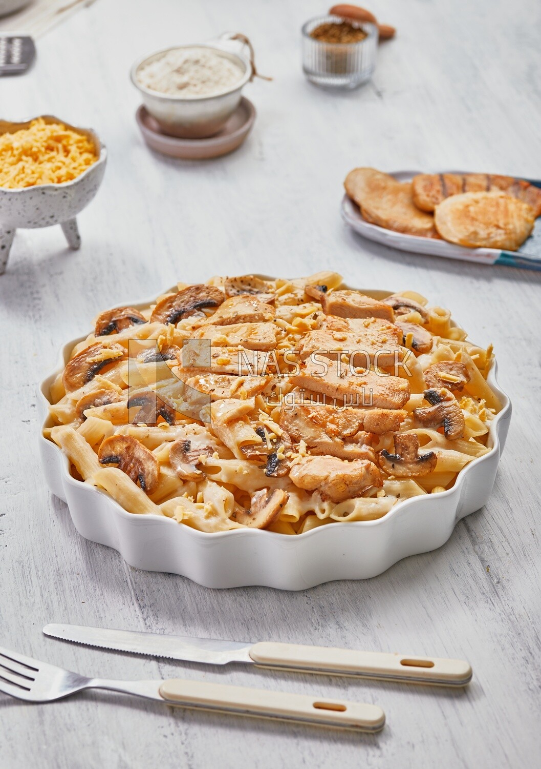 Plate of pasta with mushrooms and chicks