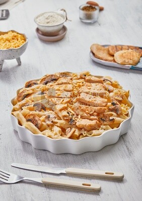 Plate of pasta with mushrooms and chicks