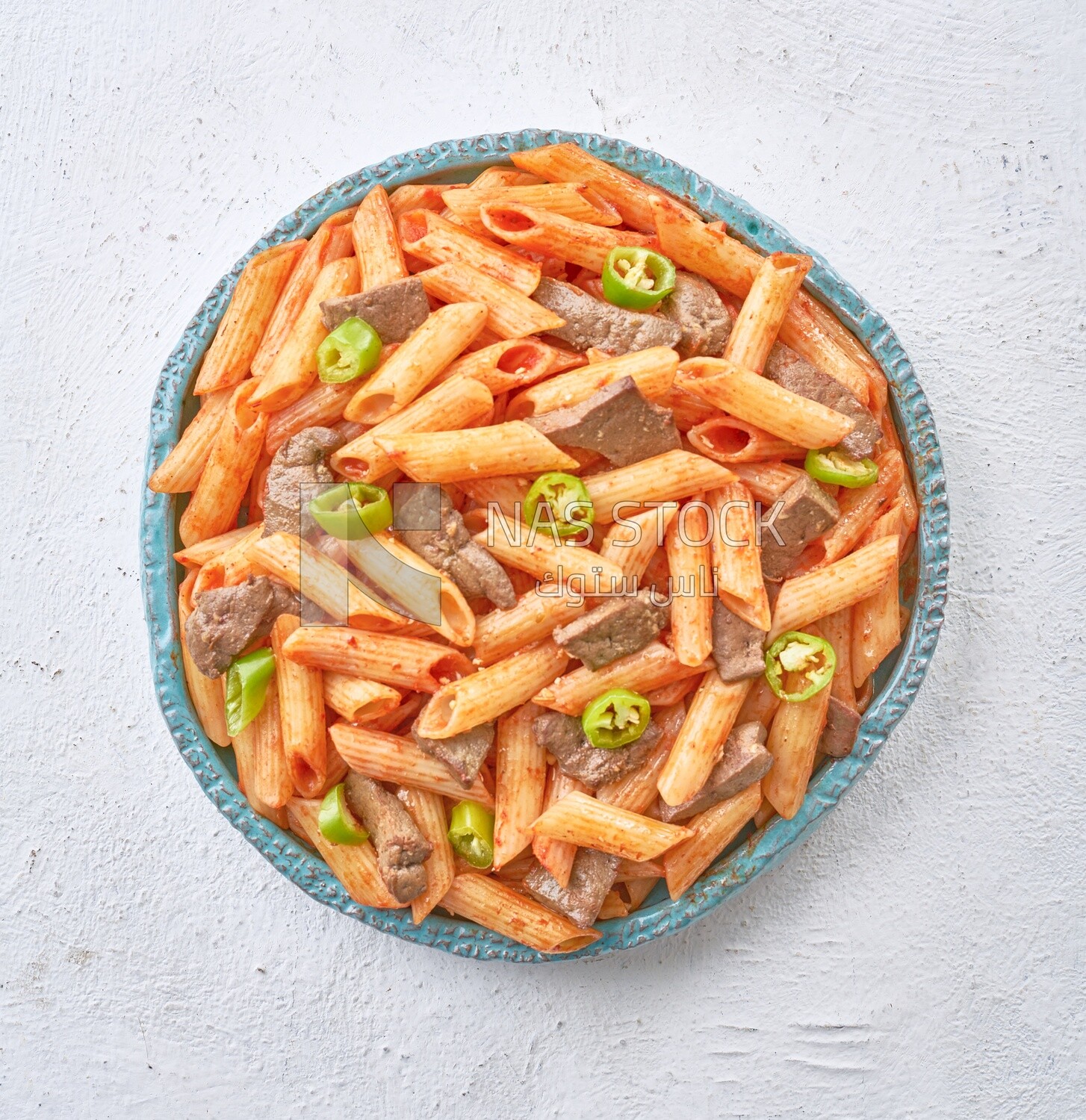 Pasta with liver and hot pepper in a solid background