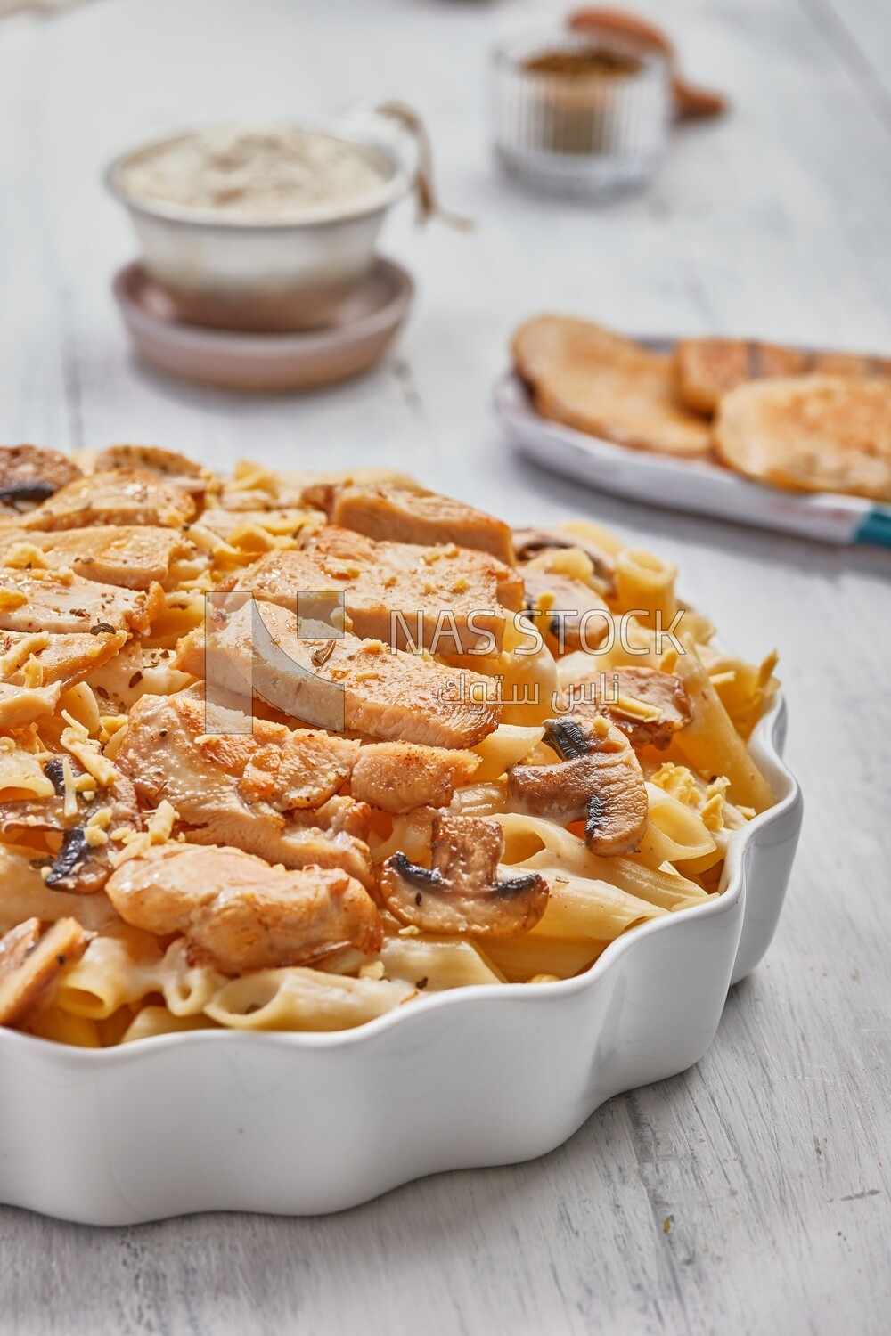 Plate of pasta with mushrooms and chickens