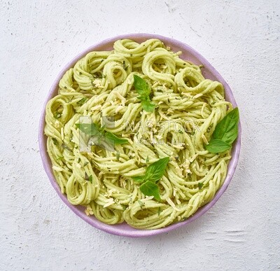 Pasta with basil on a solid background