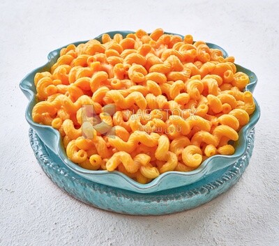 Plate of pasta and cheese on a solid background