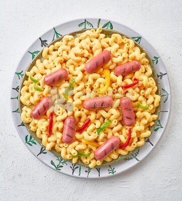 Top view of a plate of pasta with sausage