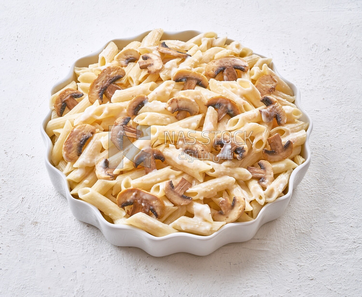 Pasta with mushrooms on a solid background