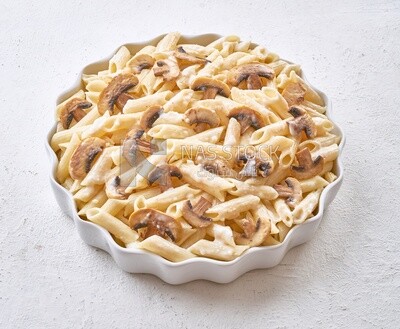 Pasta with mushrooms on a solid background