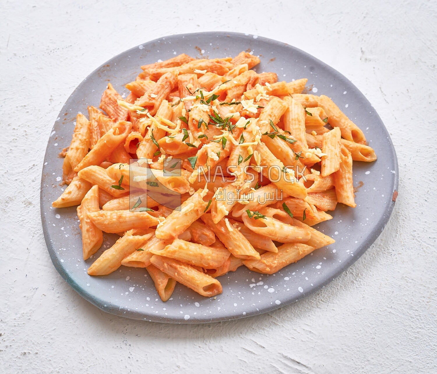 Pasta in red sauce with grated cheese