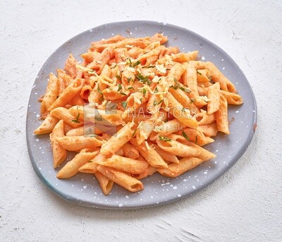 Pasta in red sauce with grated cheese