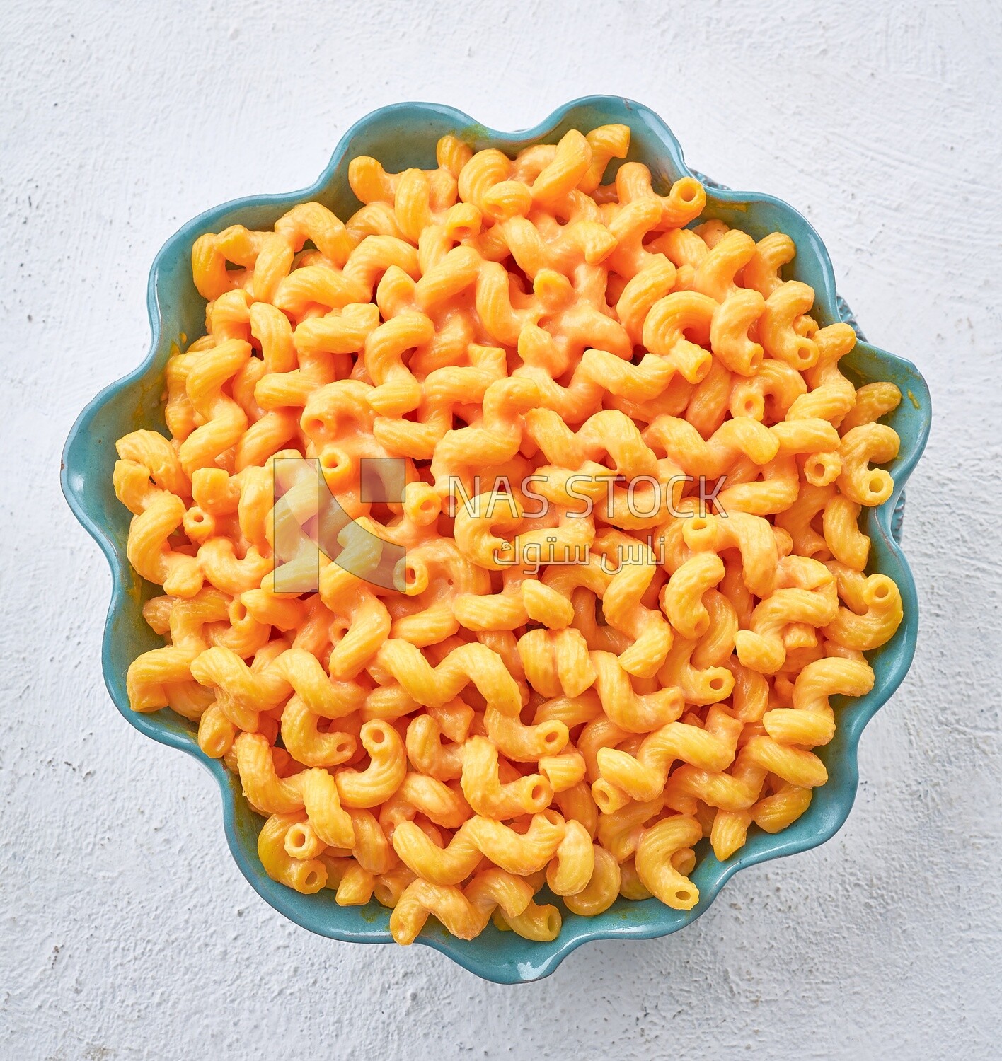 Pasta and cheese on a solid background