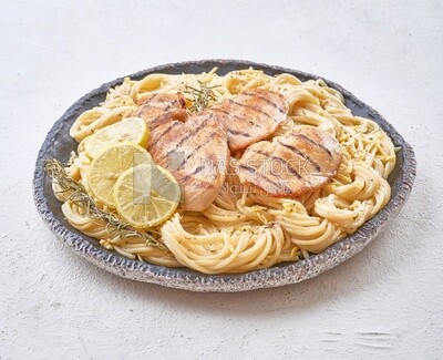 Plate of spaghetti  with chicken and lemon