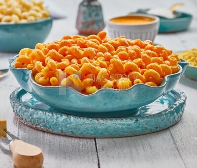 Side view of a plate of pasta and cheese